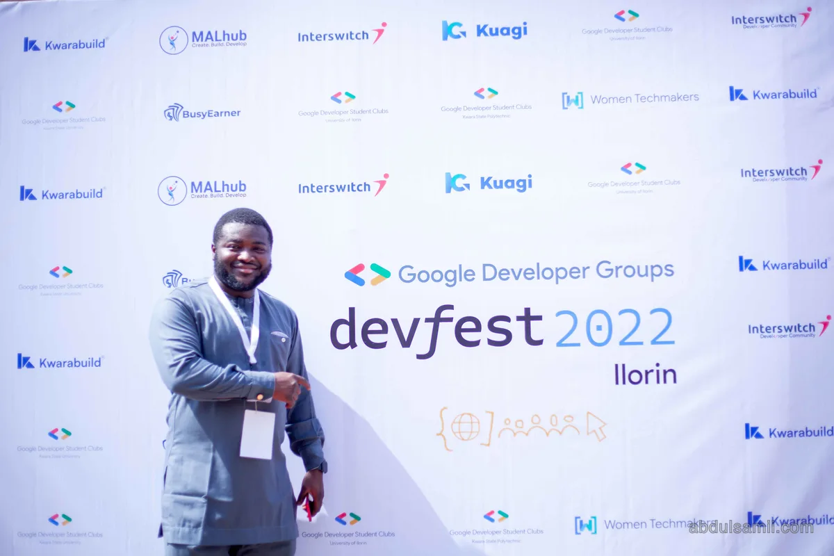 Abdulsamii in front of the Google Developer Groups DevFest banner